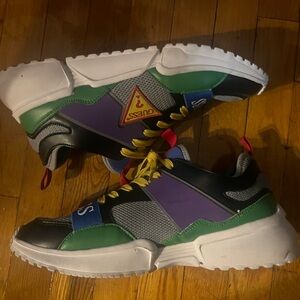 Colorful sneakers with laces and Velcro.